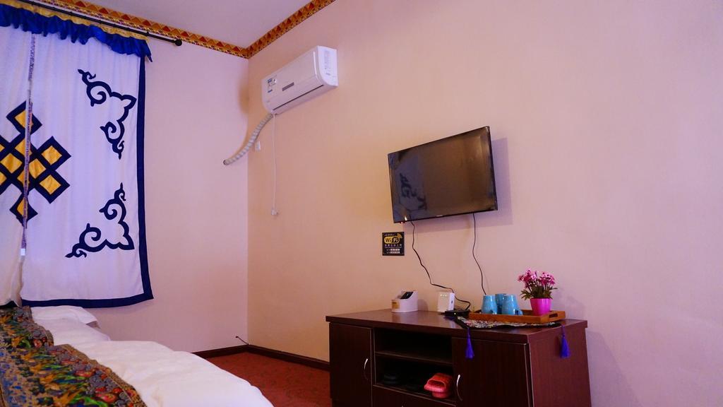 Wo Home Hostel Jiuzhaigou Rum bild